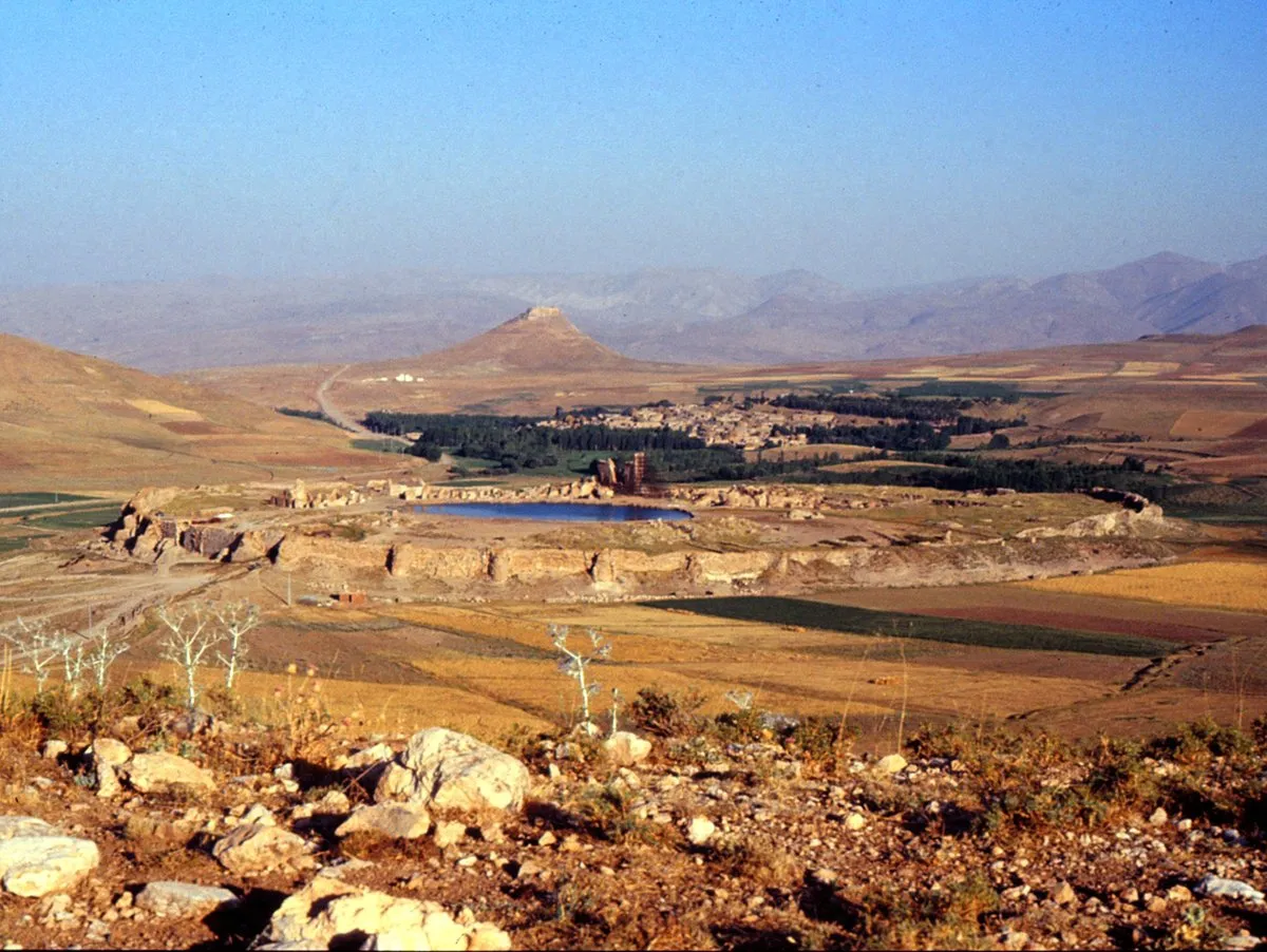 Archaeological site of Takht-e Soleyman against the mountainous backdrop of western Iran.